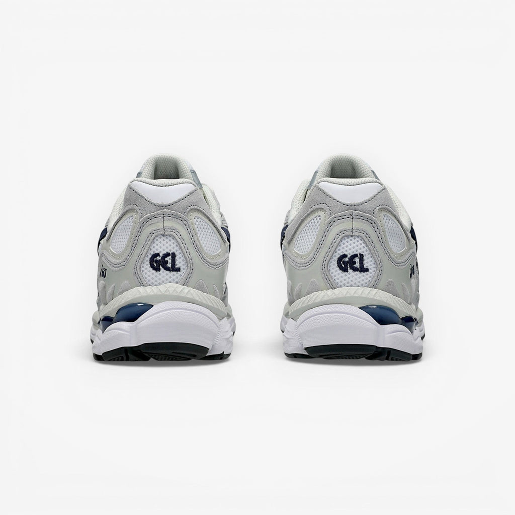 Rear view of METRO ASICS GEL-NYC sneakers in white and midnight blue with mesh, suede, and GEL cushioning technology.