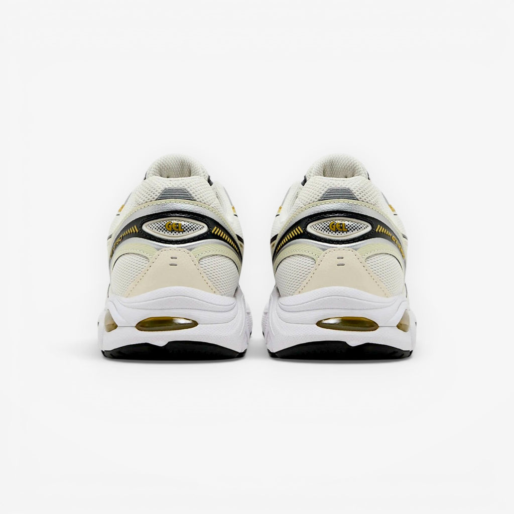 METRO ASICS GT-2160 cream and dark mustard running shoes with mesh upper and GEL cushioning.