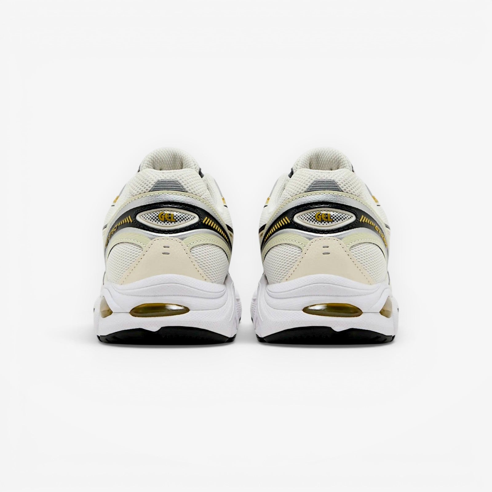 METRO ASICS GT-2160 cream and dark mustard running shoes with mesh upper and GEL cushioning.