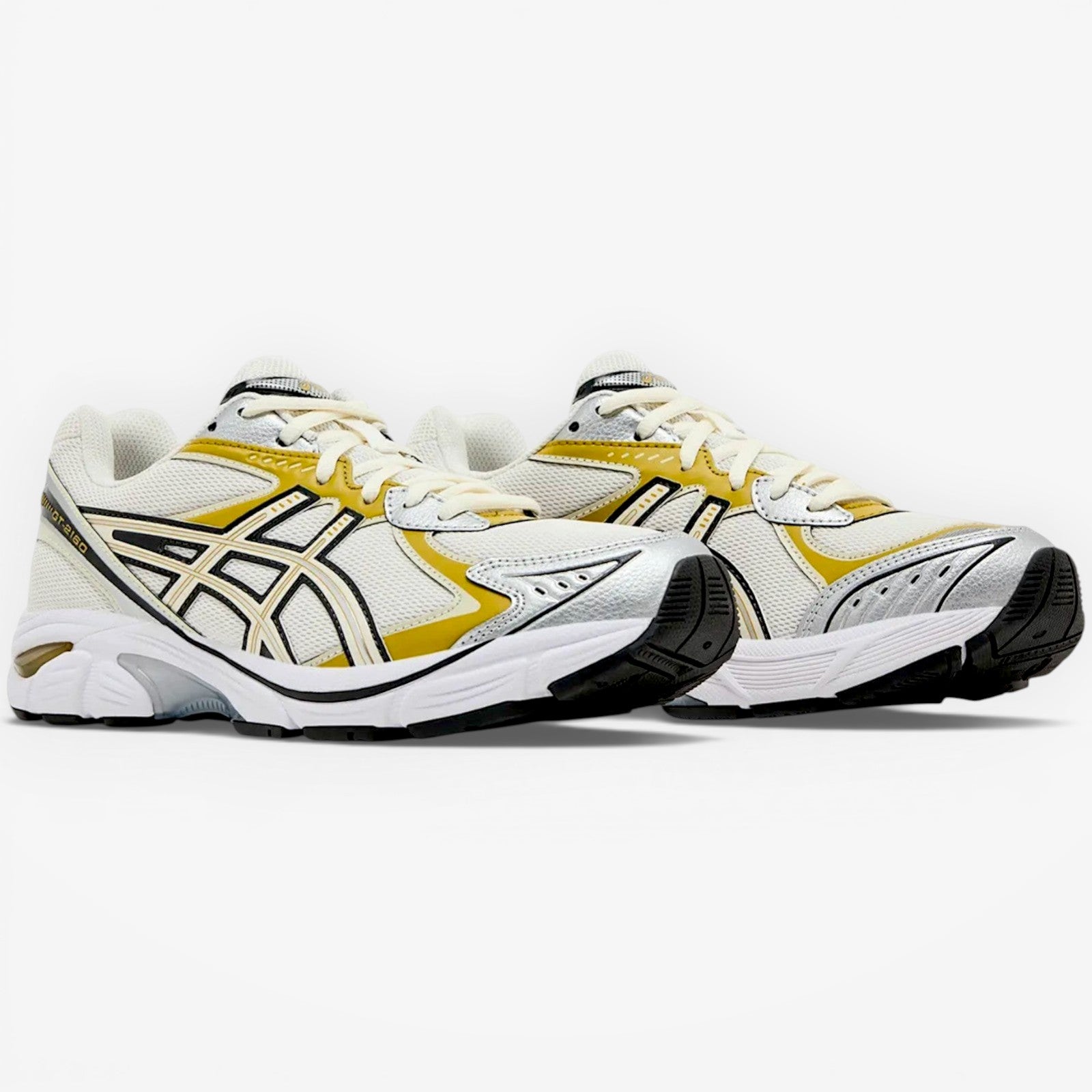METRO ASICS GT-2160 cream and dark mustard running shoes with mesh upper and GEL cushioning.