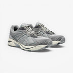 METRO ASICS GT-2160 running shoes in Oyster Grey and Carbon. Breathable mesh upper with synthetic overlays and GEL™ cushioning.