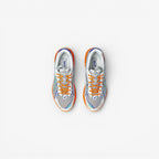 METRO ASICS UB7-S GT-2160 sneakers in Lava Orange and Jasper Green with white mesh and silver overlays.