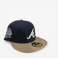METRO Atlanta Braves 150th Anniversary fitted hat in navy blue with khaki brim and white 'A' logo. Features anniversary patch.