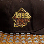METRO Atlanta Braves 1999 World Series fitted hat in brown with embroidered patch and brown UV underbrim.