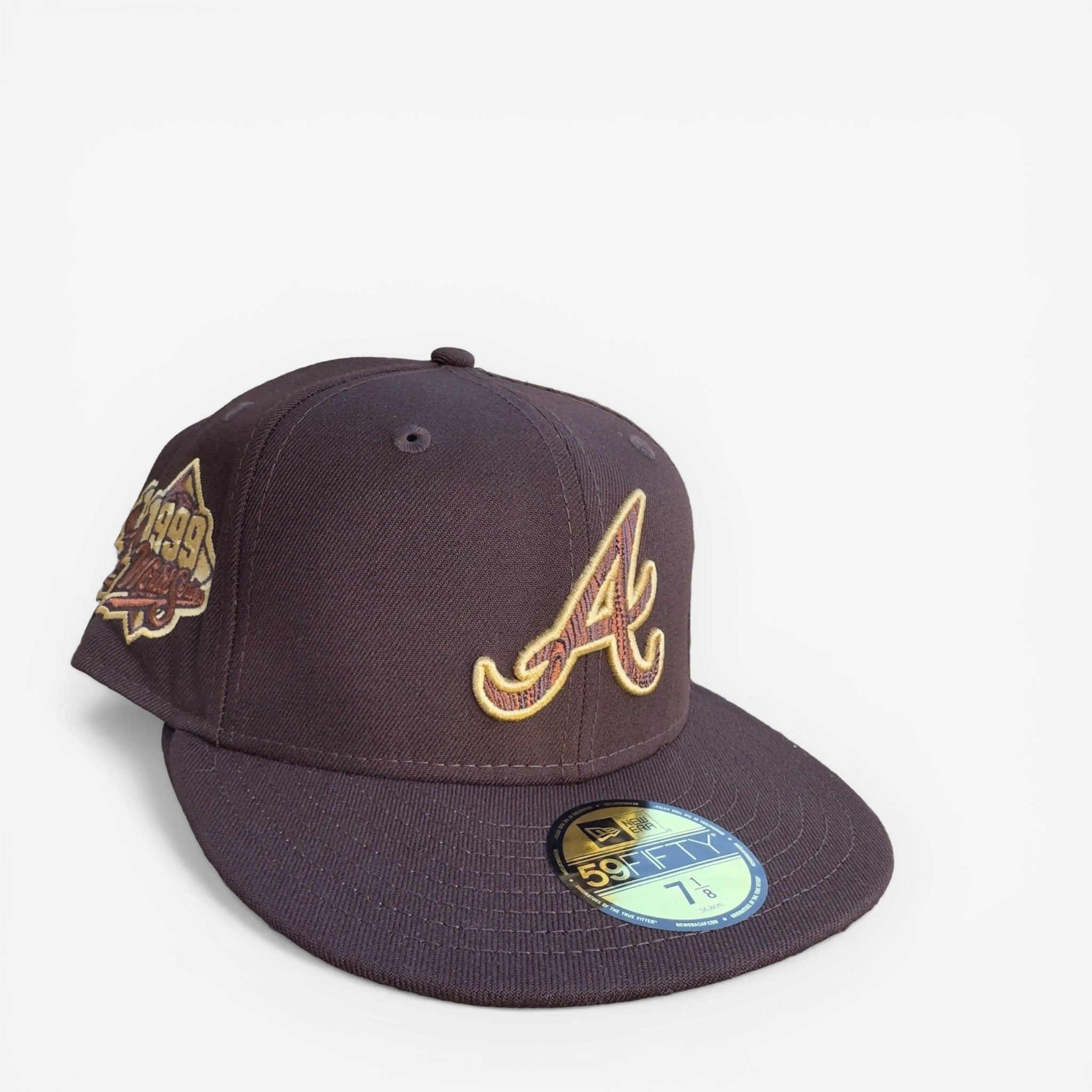 METRO Atlanta Braves 1999 World Series fitted hat in brown with embroidered 'A' logo and commemorative side patch.