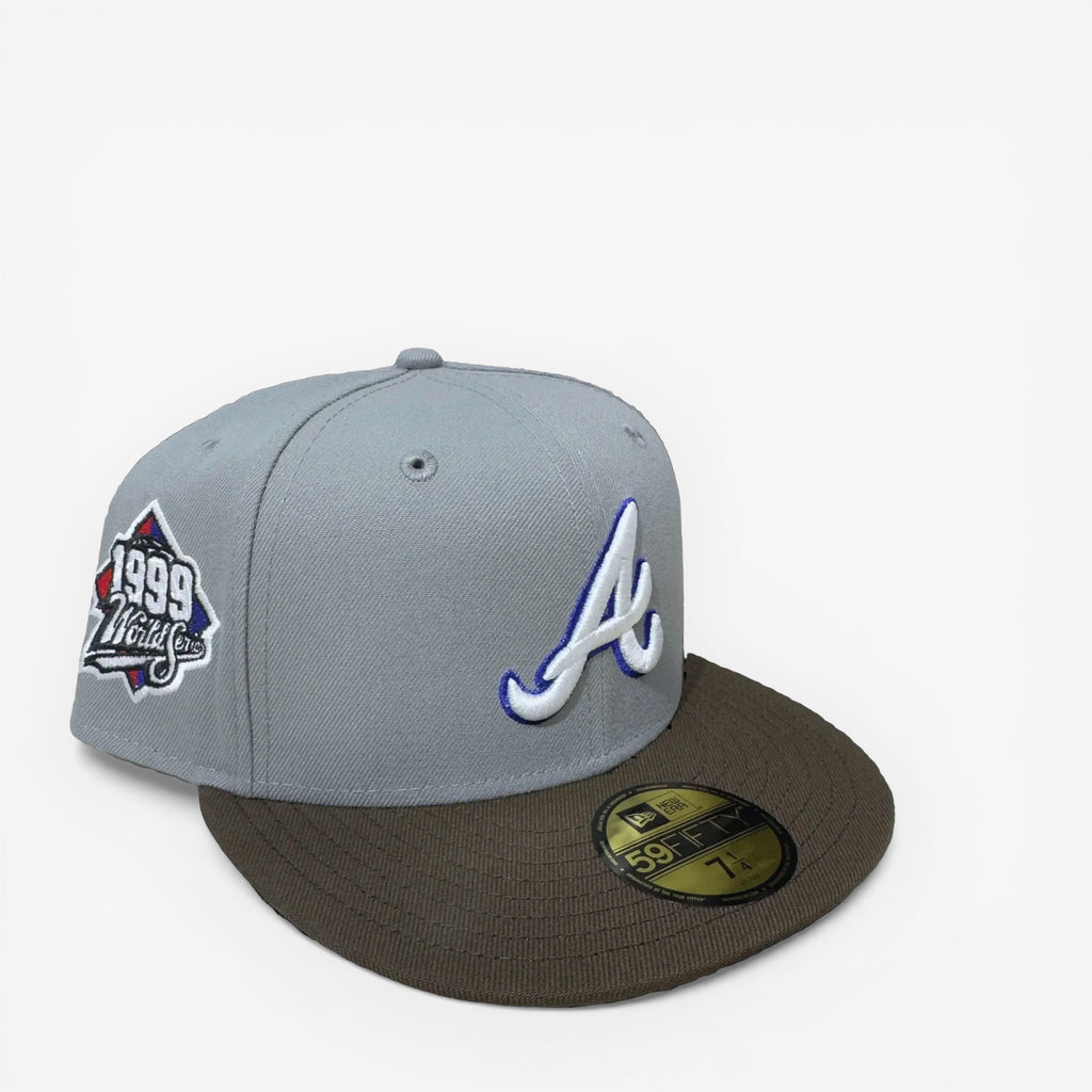 METRO Atlanta Braves 1999 World Series fitted hat in gray with a brown brim and embroidered 'A' logo. Features a 1999 World Series side patch.