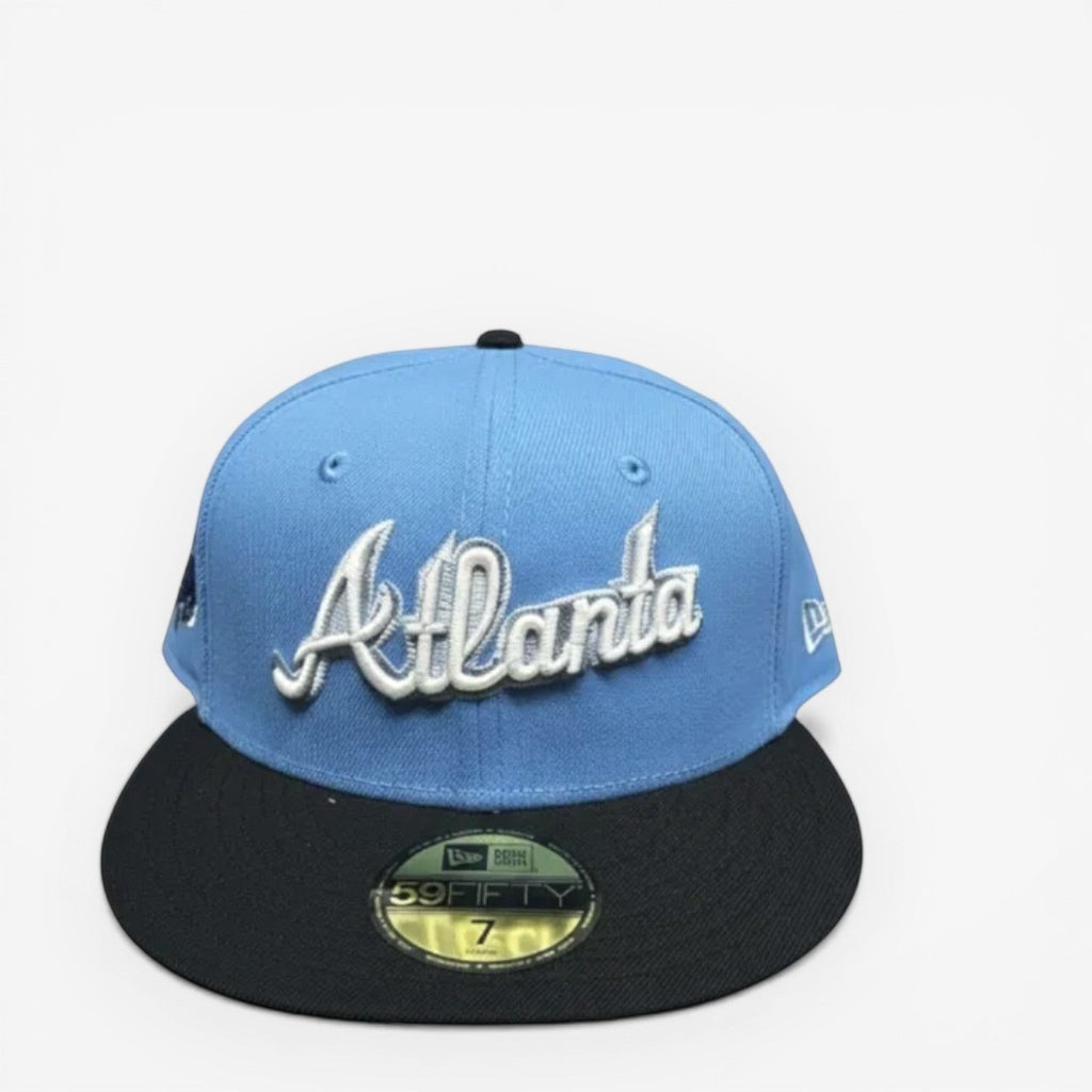 METRO Atlanta Braves blue fitted hat with white 'Atlanta' embroidery and black brim. New Era 59FIFTY silhouette.