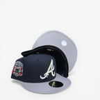 METRO Atlanta Braves navy blue fitted hat with grey brim and Inaugural Season side patch. New Era 59FIFTY silhouette.