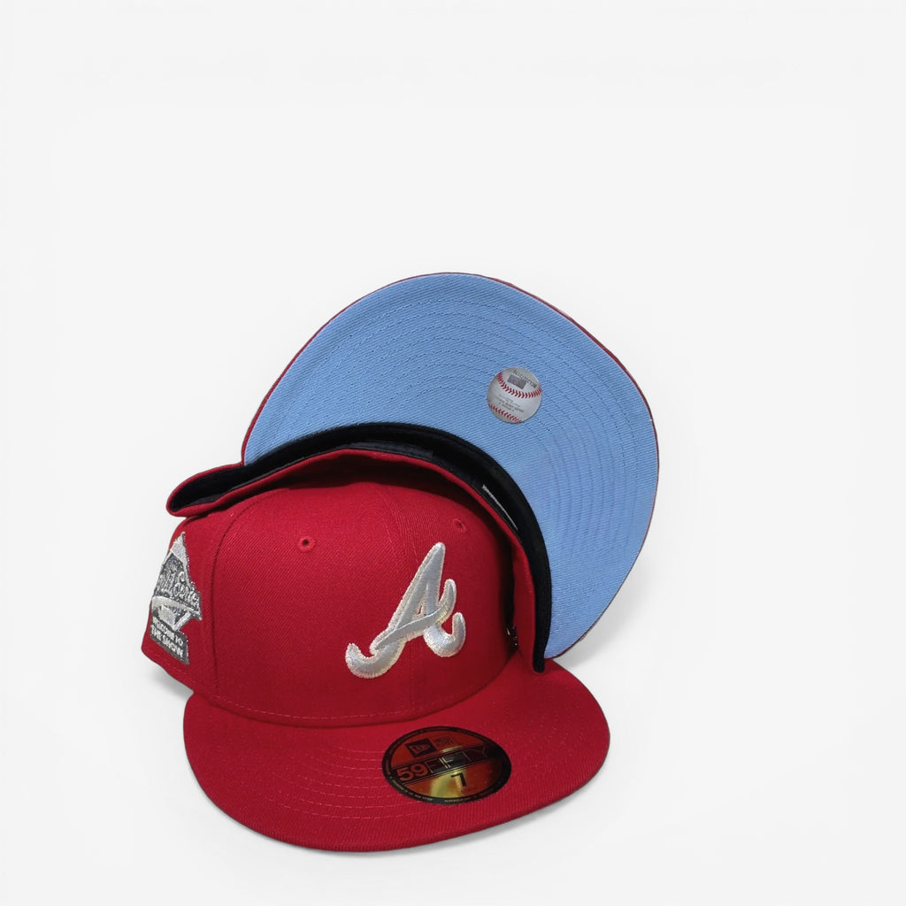 METRO Atlanta Braves red fitted hat with white A logo and "Welcome to the Show" side patch. Light blue underbrim.