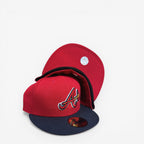 METRO Atlanta Braves red fitted hat with navy brim and embroidered 'A' logo. Features a red underbrim and flat visor.