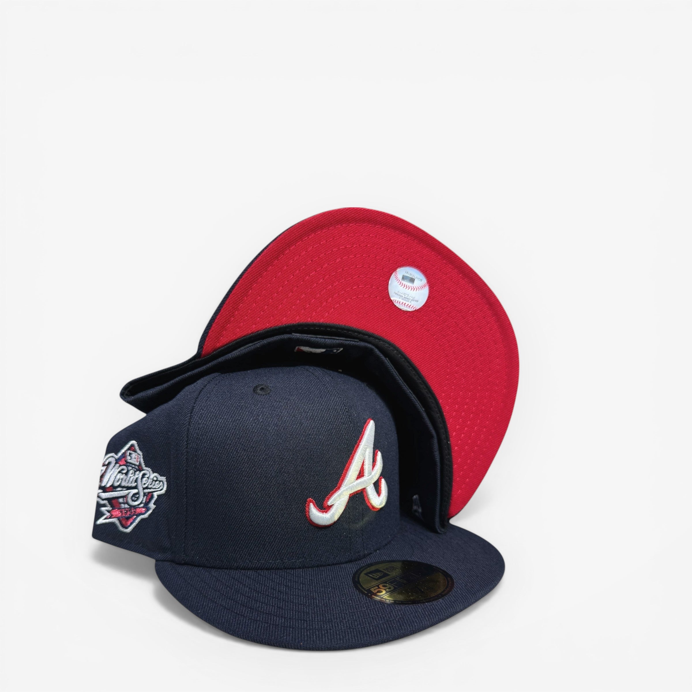 METRO Atlanta Braves navy fitted hat with red underbrim, featuring metallic World Series side patch and embroidered A logo.