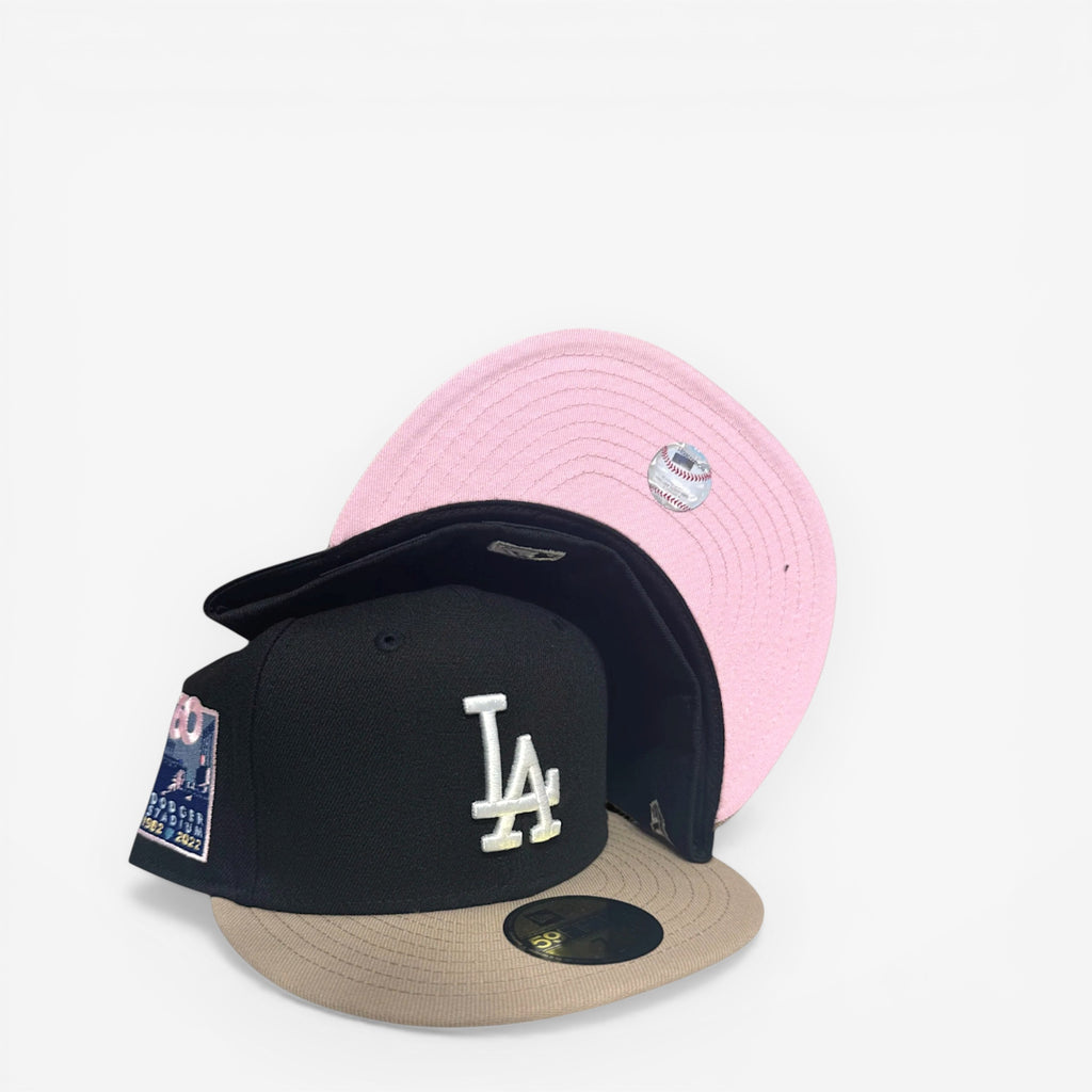 METRO Los Angeles Dodgers 60th Anniversary fitted hat in black with khaki brim and pink UV underbrim. Features iconic LA logo and anniversary patch.