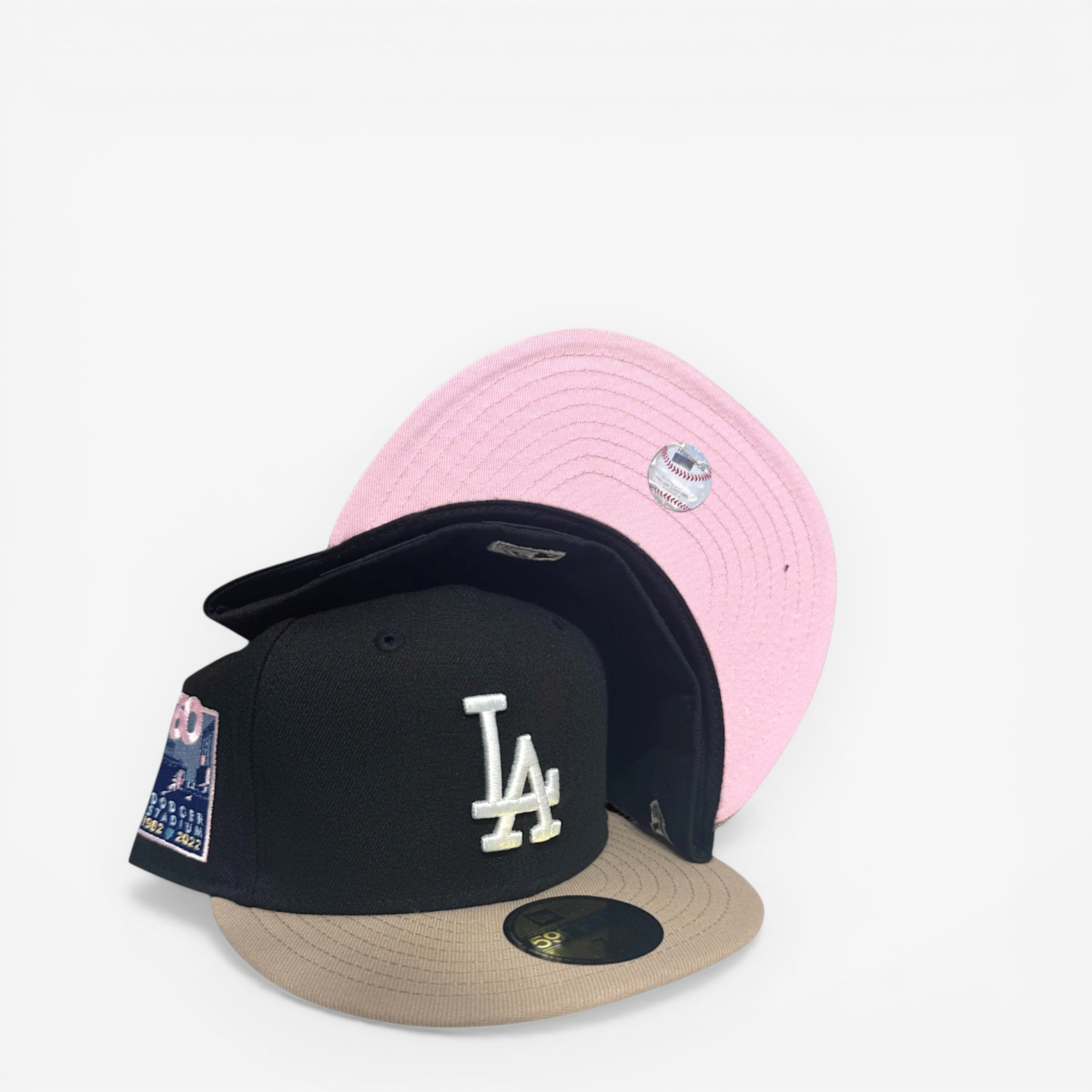 METRO Los Angeles Dodgers 60th Anniversary fitted hat in black with khaki brim and pink UV underbrim. Features iconic LA logo and anniversary patch.