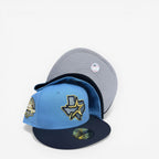METRO Houston Astros 45th Anniversary blue fitted hat with navy brim and grey UV underbrim, featuring a commemorative side patch.