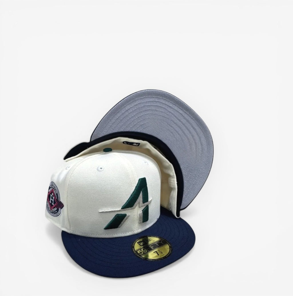 METRO Houston Astros white, navy, and grey UV polyester fitted hat with flat brim and grey undervisor.