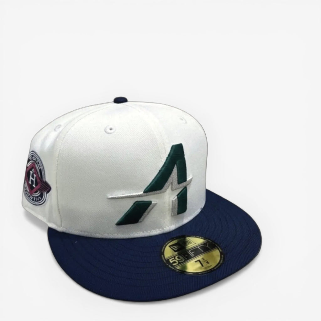 METRO Houston Astros white polyester fitted hat with navy brim and green "A" logo. Features a grey undervisor and side patch.