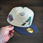 METRO Houston Astros white and navy polyester 59FIFTY fitted hat with green 'A' logo and side patch.