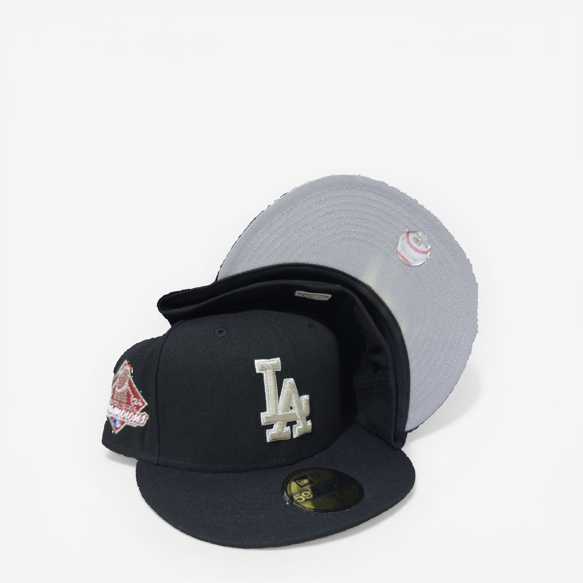 METRO LA Dodgers 2024 World Series Champions fitted hat in black with silver embroidery and grey underbrim.