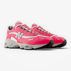 METRO New Balance 1000 Dragon Berry sneakers featuring vibrant pink overlays, white mesh, and metallic silver accents.