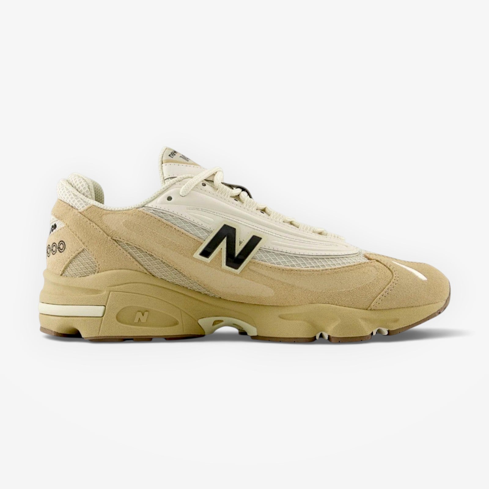 METRO New Balance 1000 sneakers in incense and black featuring suede overlays, mesh underlays, and ABZORB cushioning.