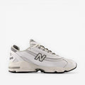 new balance white sneaker with mesh and leather panels, grey accents, side profile on black background