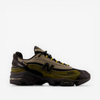 New Balance sneaker with black, olive, and beige tones, mesh and suede panels, side N logo