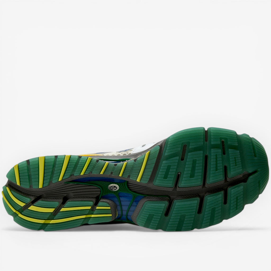 METRO Action Bronson x New Balance 1890 "Hornet / Tusk" running shoe with green, yellow, and blue sole.