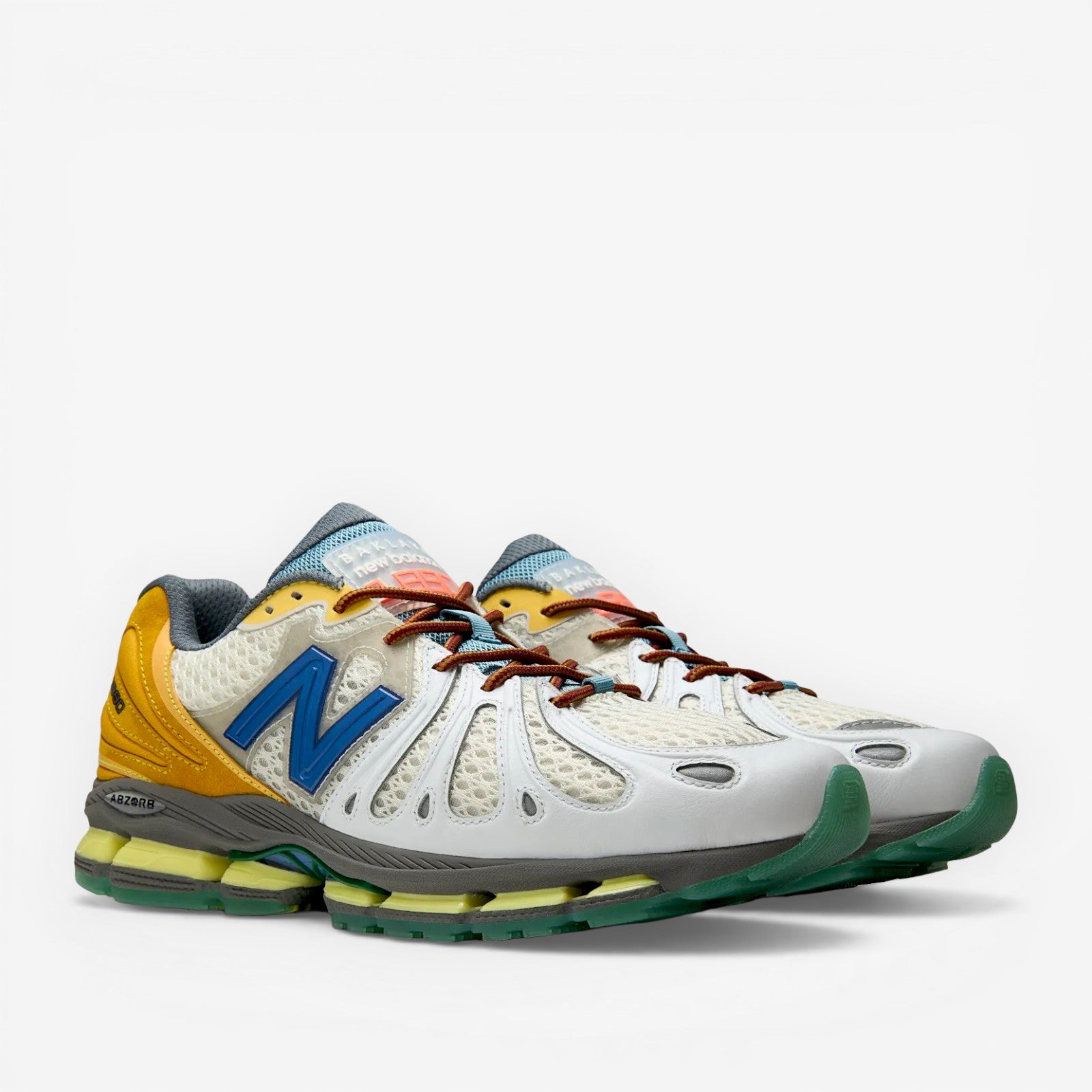 METRO Action Bronson x New Balance 1890 "Hornet / Tusk" sneakers in white mesh, suede, with blue N logo and yellow heel.