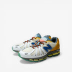 METRO Action Bronson x New Balance 1890 "Hornet / Tusk" sneakers in white mesh, suede, and synthetic with blue, yellow, and green accents.