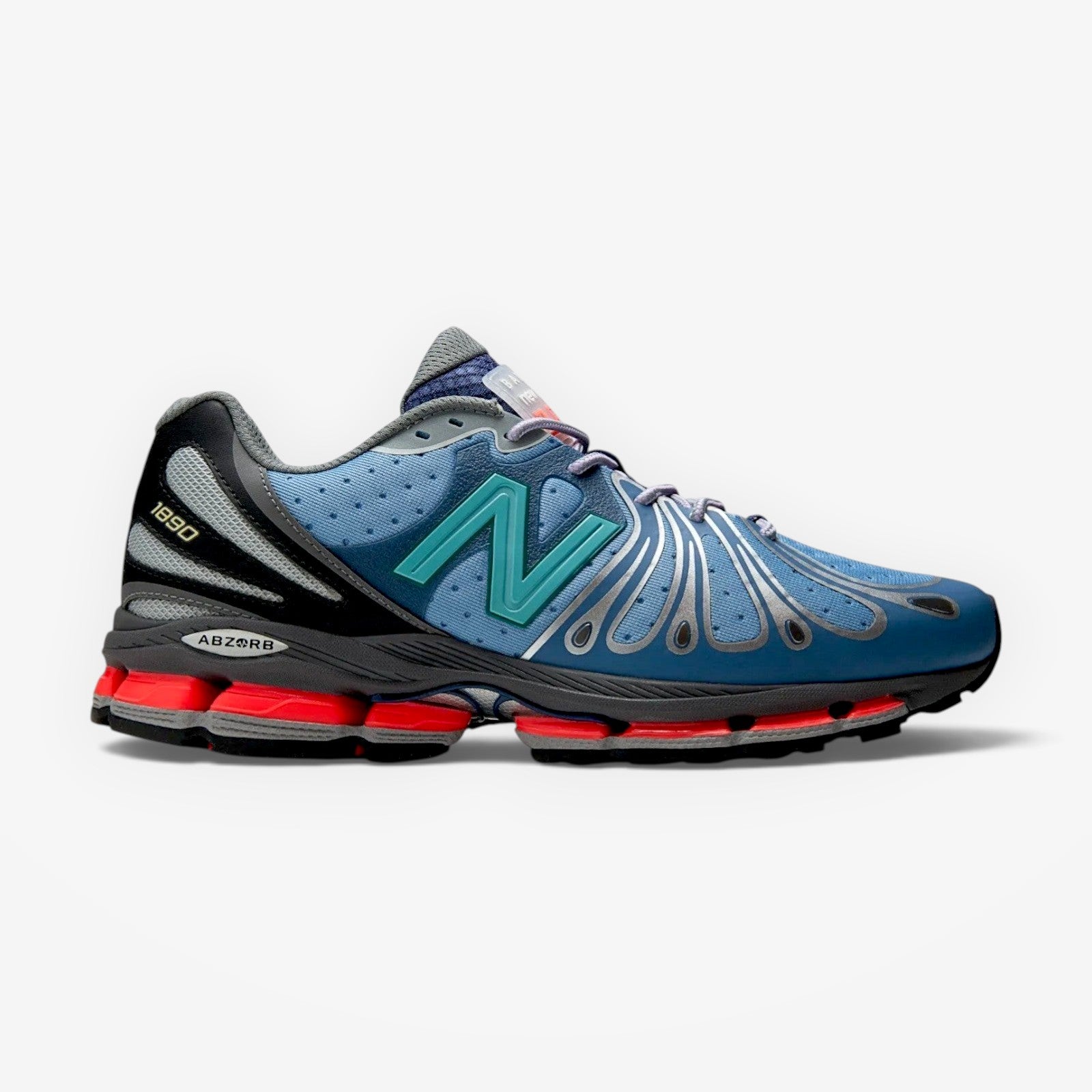 METRO New Balance x Action Bronson 1890 Medusa Azul sneaker in blue, grey, and red with mesh and suede overlays.