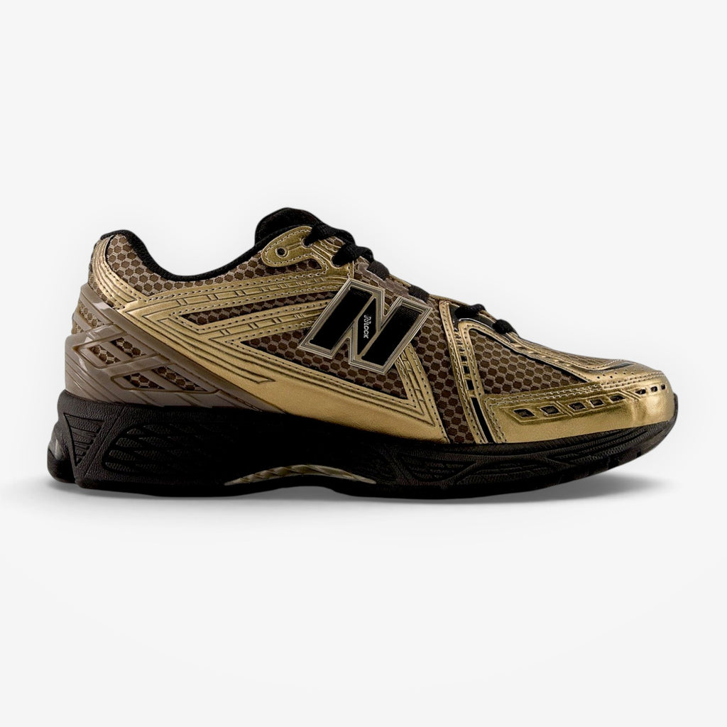 METRO New Balance 1906R sneaker in black and bronze with mesh and synthetic overlays on a white background