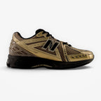 METRO New Balance 1906R sneaker in black and bronze with mesh and synthetic overlays on a white background