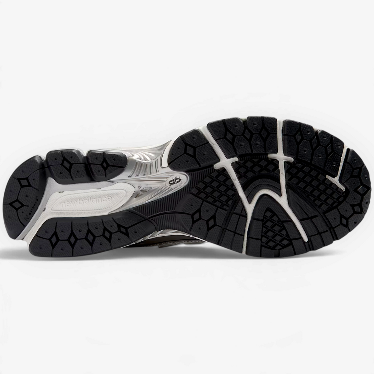METRO New Balance 1906R sneaker showing the black rubber N-ergy outsole with Stability Web arch support