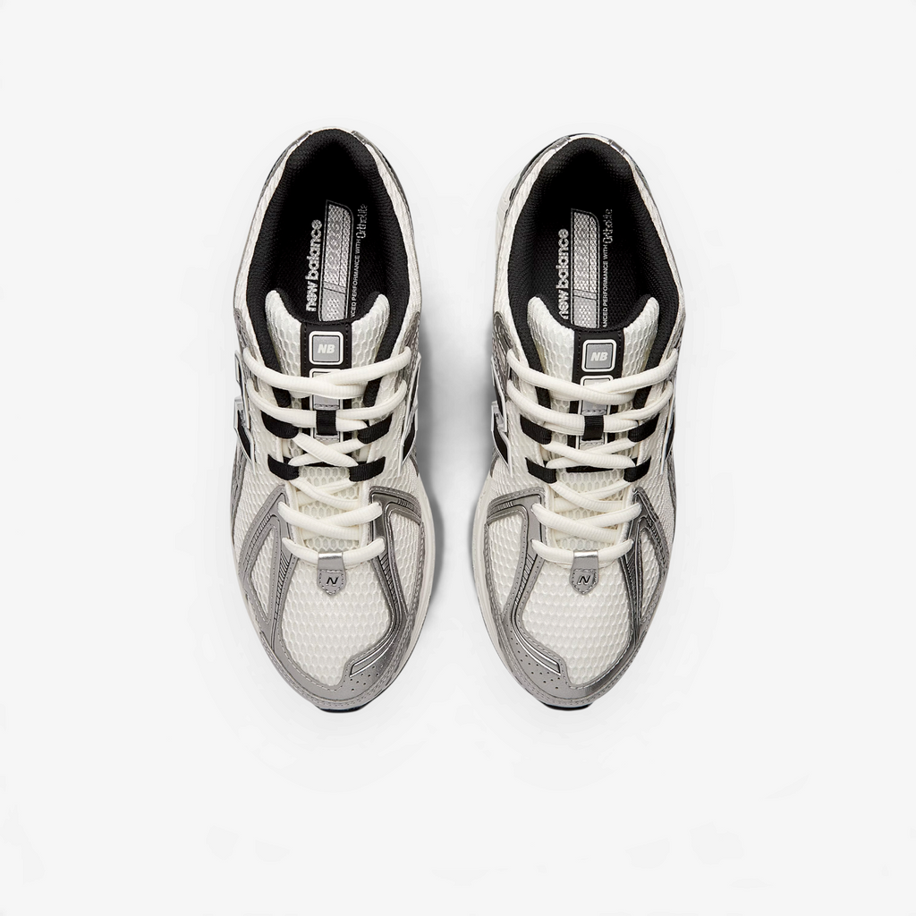 METRO New Balance 1906R sneakers in silver metallic, white, and sea salt with mesh and synthetic overlays, top view.