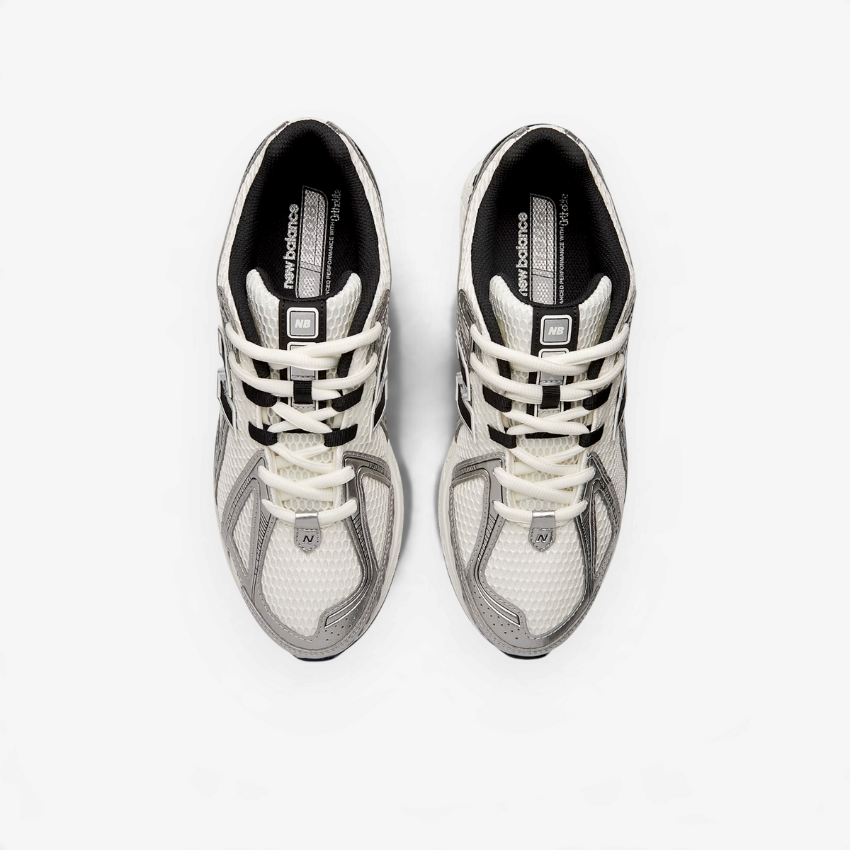METRO New Balance 1906R sneakers in silver metallic, white, and sea salt with mesh and synthetic overlays, top view.