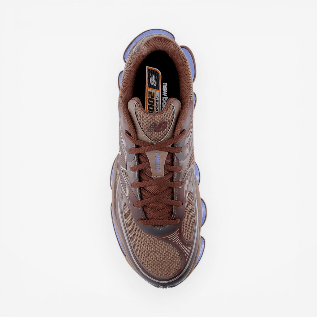 METRO New Balance 2000 Pumpernickel sneakers with brown mesh upper and blue cushioning.