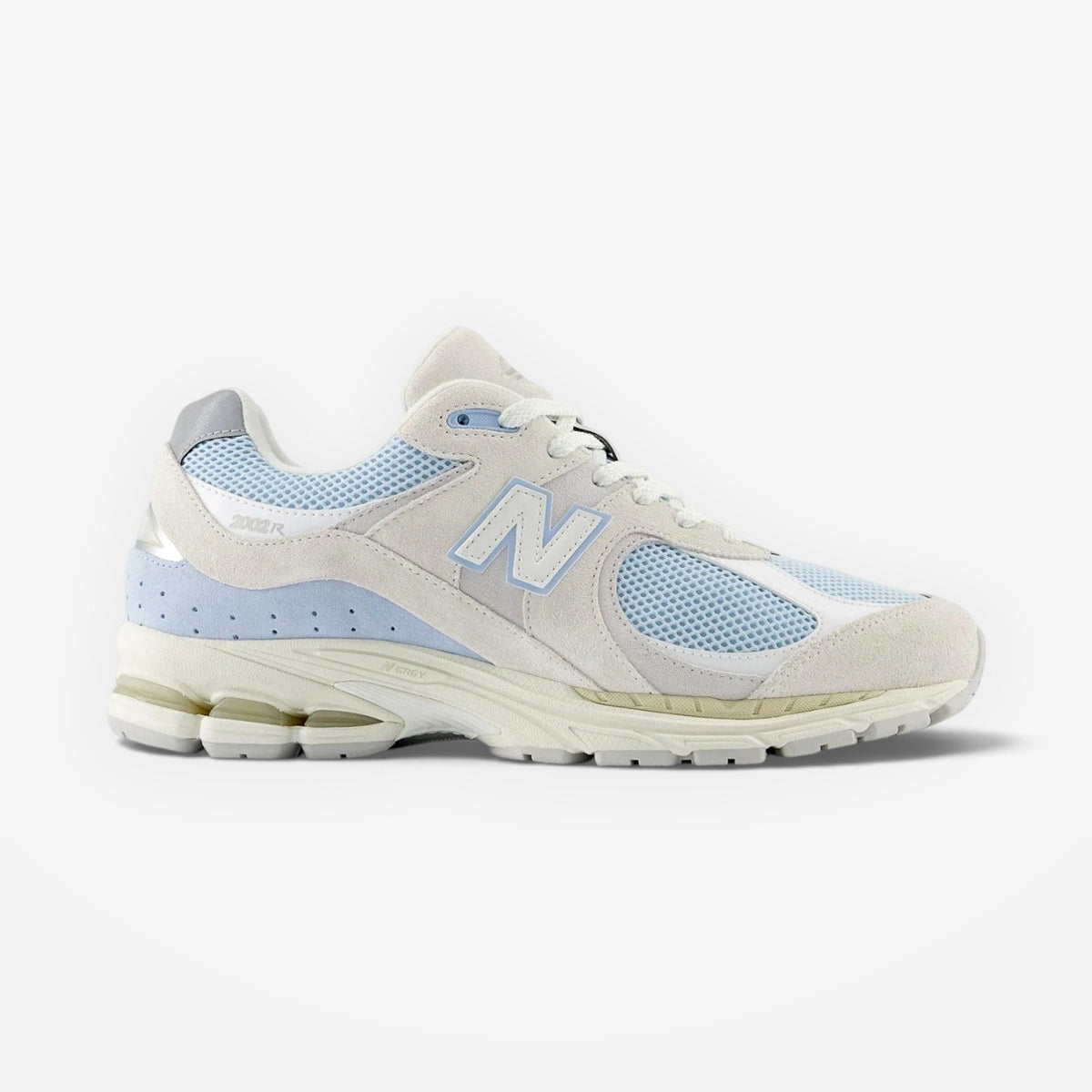 METRO New Balance 2002R sneaker in light blue and off-white with suede overlays, mesh panels, and N-ergy foam midsole.