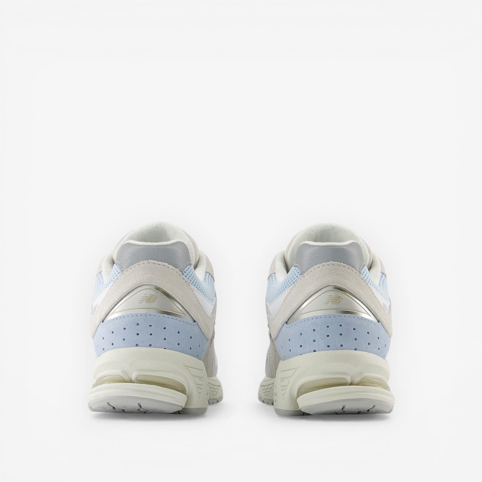 METRO New Balance 2002R blue suede and mesh running sneakers with N-ergy foam sole.