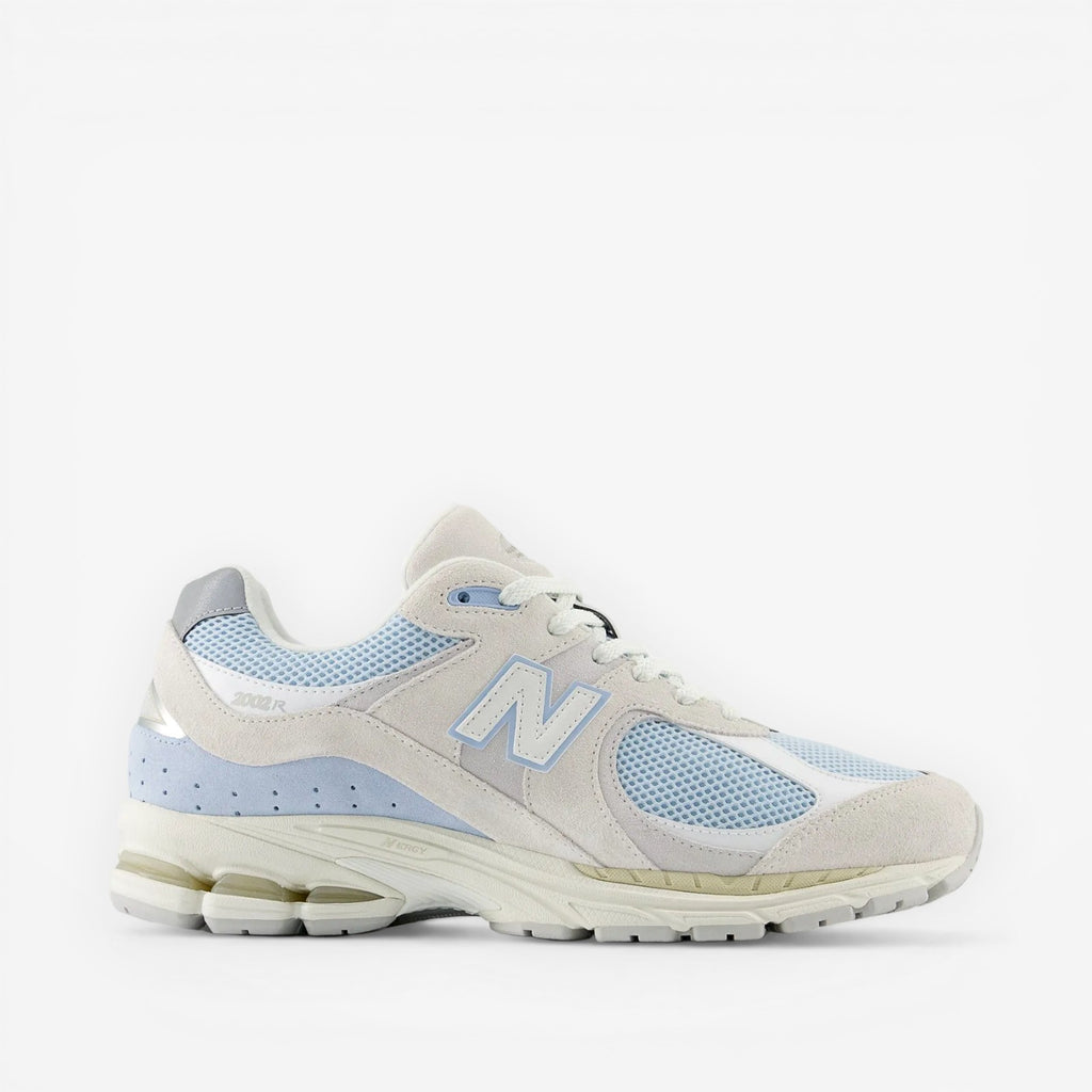 Light blue and white New Balance 2002R sneaker with mesh and suede details, footwear