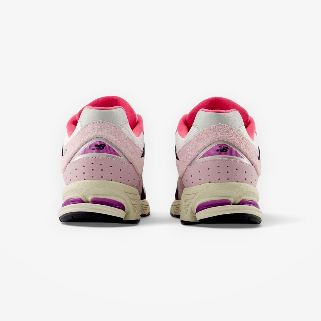 METRO New Balance 2002R Twilight Haze Passion Fruit sneakers in pink and purple suede and mesh, rear view.