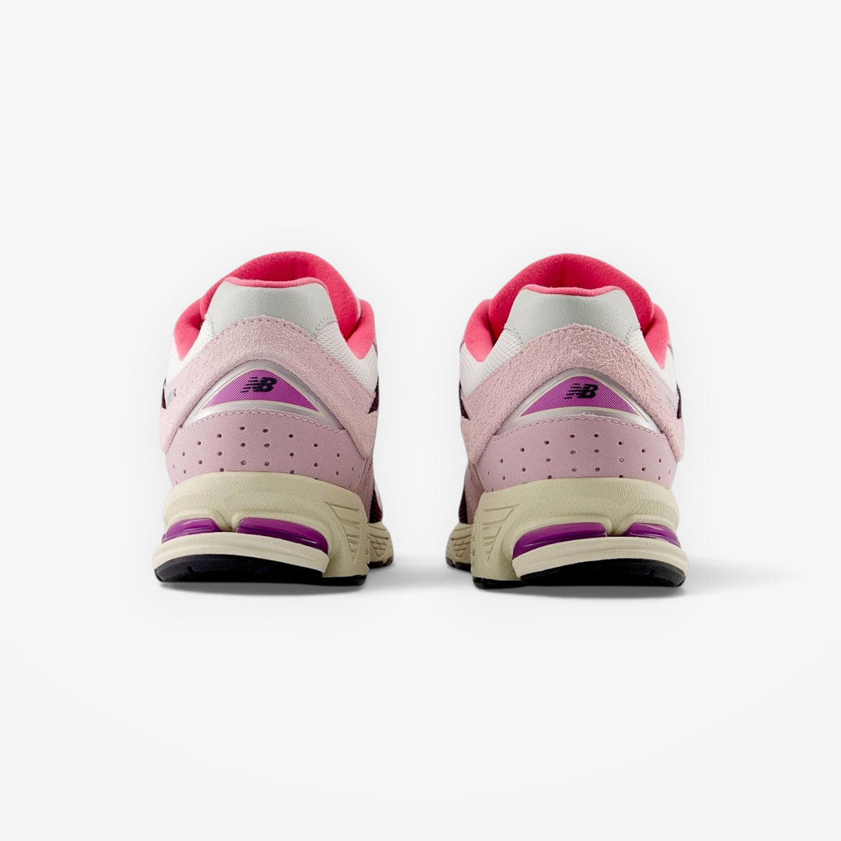 METRO New Balance 2002R Twilight Haze Passion Fruit sneakers in pink and purple suede and mesh, rear view.