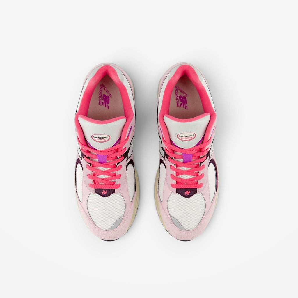 METRO New Balance 2002R sneakers in twilight haze and passion fruit pink suede and mesh, top-down view.