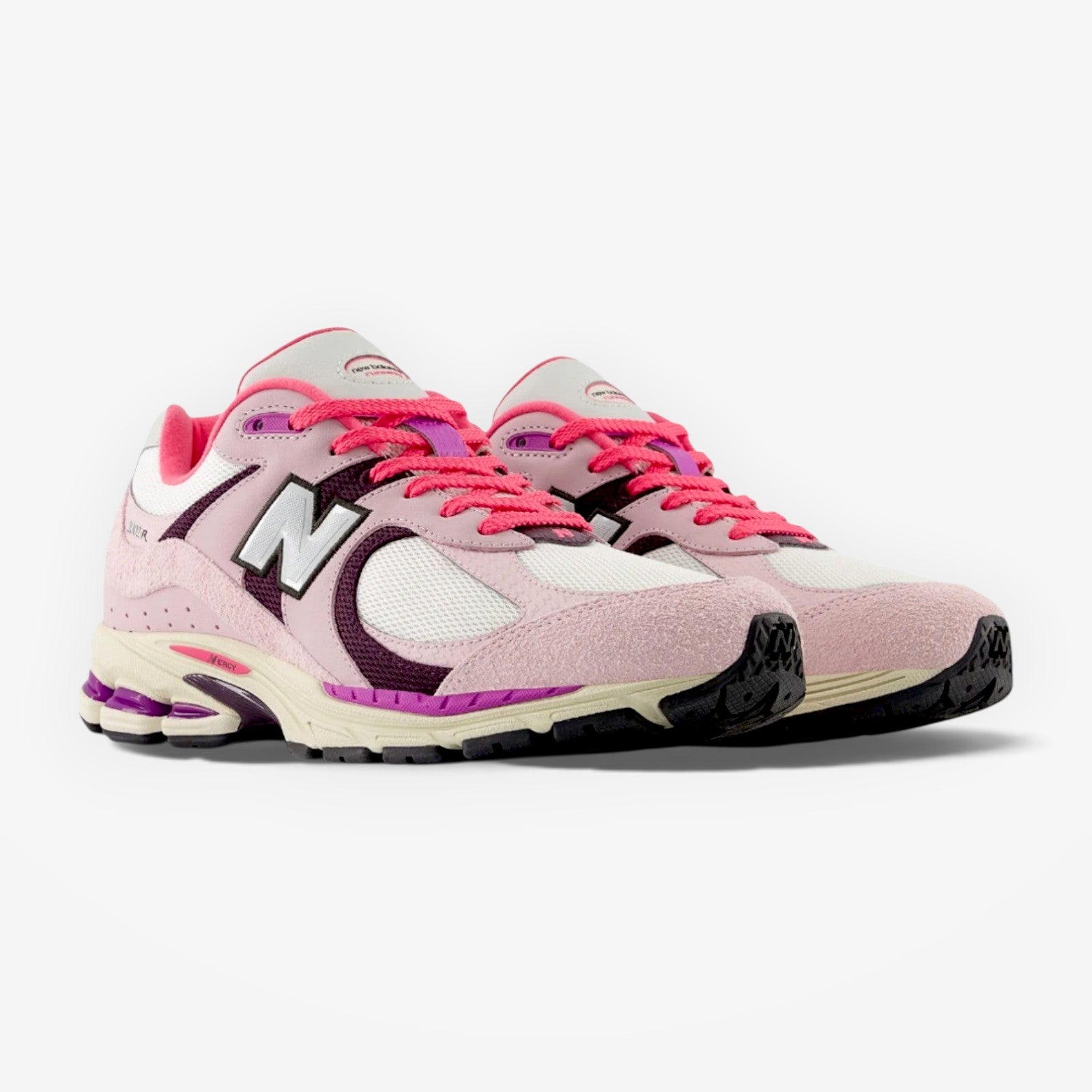 METRO New Balance 2002R sneakers in twilight haze and passion fruit pink suede and mesh with N-ergy cushioning.