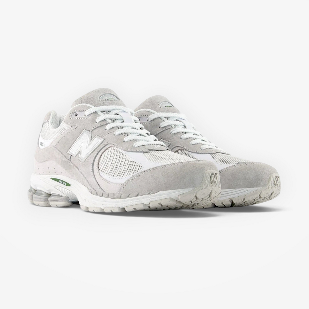 New Balance grey and white suede mesh sneakers, lifestyle footwear, front angle view