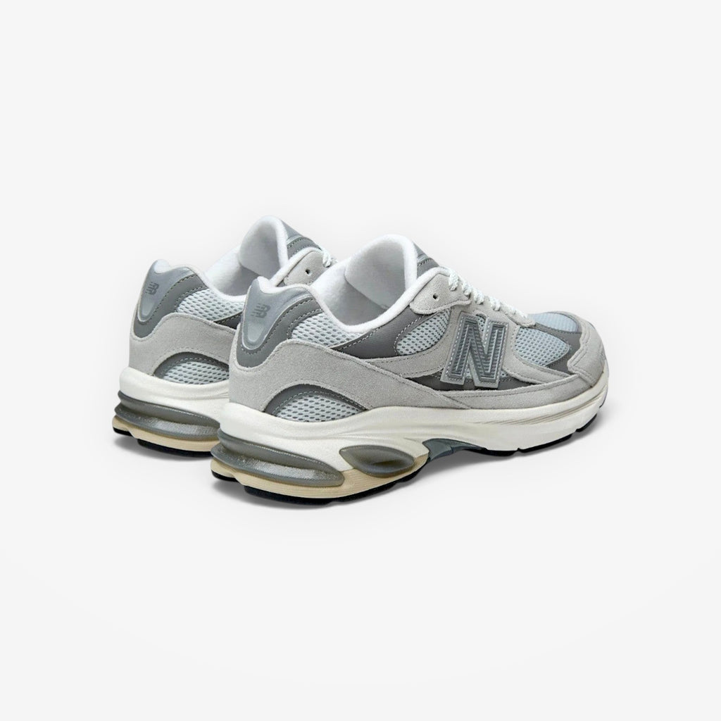 METRO New Balance 2010 sneakers in Raincloud and Harbor Grey mesh and suede with signature N branding, rear view.