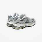 METRO New Balance 2010 sneakers in Raincloud and Harbor Grey mesh and suede with signature N branding, rear view.
