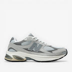METRO New Balance 2010 sneakers in Raincloud and Harbor Grey. Mesh, suede, and synthetic upper with cushioned foam midsole and rubber outsole.