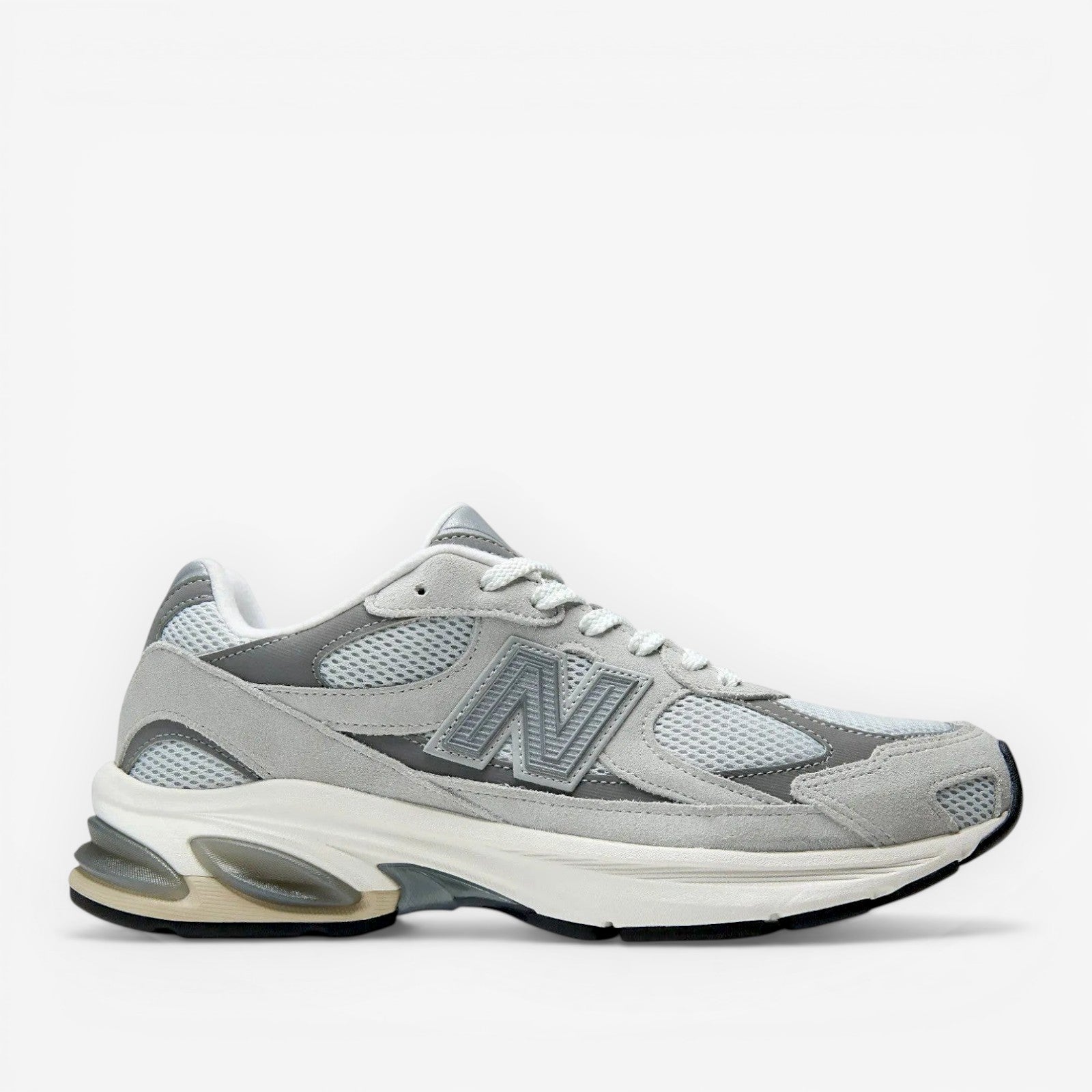 METRO New Balance 2010 sneakers in Raincloud and Harbor Grey. Mesh, suede, and synthetic upper with cushioned foam midsole and rubber outsole.