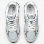 METRO New Balance 2010 sneakers in Raincloud and Harbor Grey. Mesh, suede, and synthetic upper with cushioned foam midsole and rubber outsole.