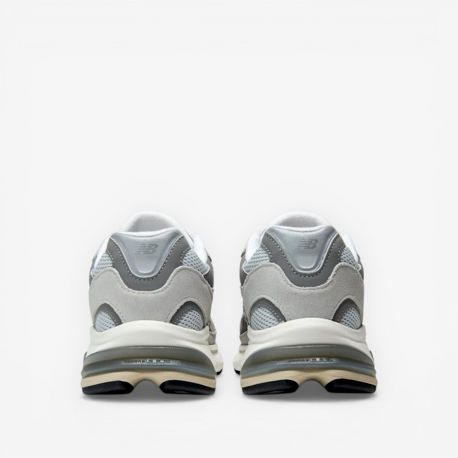 METRO New Balance 2010 sneakers in Raincloud and Harbor Grey. Mesh, suede, and synthetic upper with cushioned foam midsole and rubber outsole.
